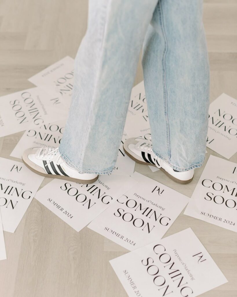 62ff6046a1adcf548f28050ea51404c4 Person in jeans and sneakers standing on Coming Soon Summer 2024 flyers on a wooden floor, hinting at an upcoming event or launch. | Sky Rye Design Person in jeans and sneakers standing on Coming Soon Summer 2024 flyers on a wooden floor, hinting at an upcoming event or launch.