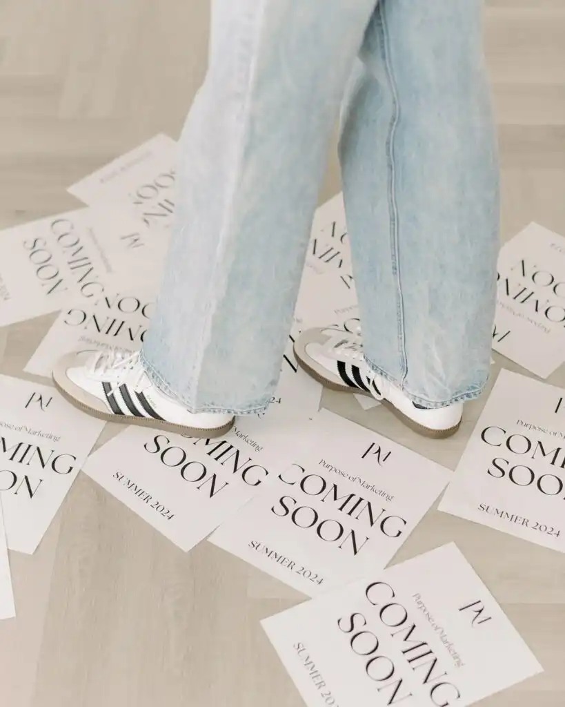 62ff6046a1adcf548f28050ea51404c4 Person in jeans and sneakers standing on Coming Soon Summer 2024 flyers on a wooden floor, hinting at an upcoming event or launch. | Sky Rye Design Person in jeans and sneakers standing on Coming Soon Summer 2024 flyers on a wooden floor, hinting at an upcoming event or launch.
