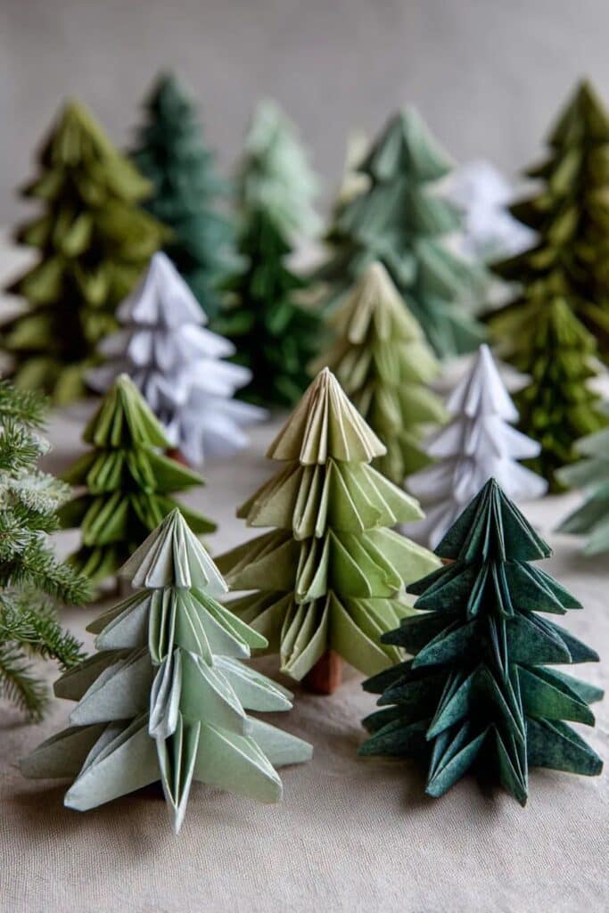 6fc2d2b053c27081bf948f134dfbdb9c Origami Christmas trees in various green shades displayed on a table, creating a festive and creative holiday decoration scene. | Sky Rye Design Origami Christmas trees in various green shades displayed on a table, creating a festive and creative holiday decoration scene.