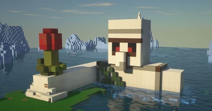 _ 7 Minecraft scene with a large building resembling an Iron Golem by the sea, featuring a pixelated red flower statue beside it. | Sky Rye Design Minecraft scene with a large building resembling an Iron Golem by the sea, featuring a pixelated red flower statue beside it.