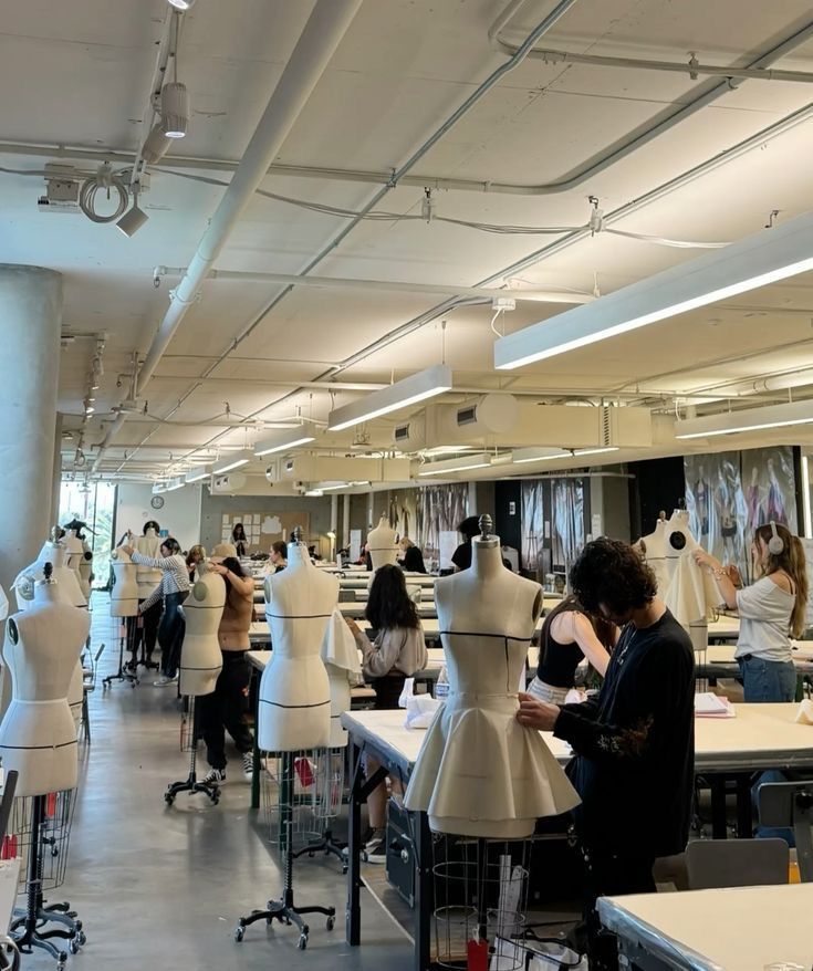 _ 7 Fashion design students work with dress forms in a bright, spacious studio, creating garments and honing their skills. | Sky Rye Design Fashion design students work with dress forms in a bright, spacious studio, creating garments and honing their skills.