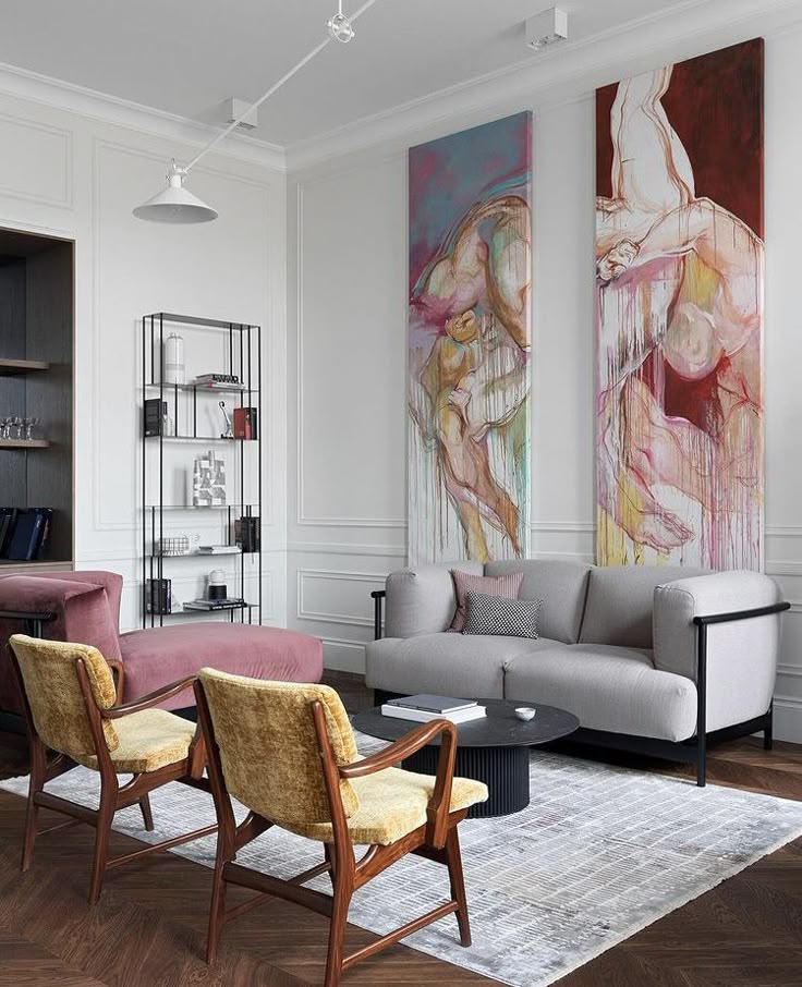 Modern living room with abstract art, mid-century furniture, and cozy seating. Sophisticated interior design with soft lighting and decor.