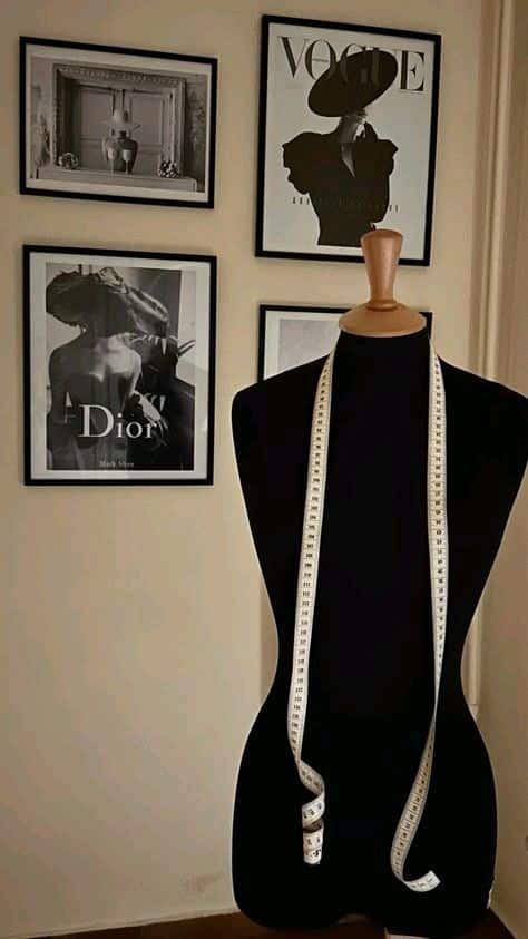 _ 9 Fashion design studio with mannequin and measuring tape, framed fashion photos on wall, creative workspace for style inspiration. | Sky Rye Design Fashion design studio with mannequin and measuring tape, framed fashion photos on wall, creative workspace for style inspiration.