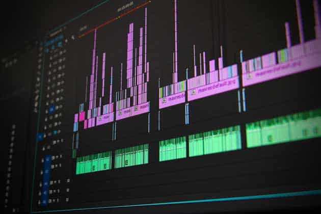 AI-Music-Generator-for-Creators-and-Artists Close-up of a video editing software interface displaying colorful timeline tracks and waveforms, representing audio and video editing process. | Sky Rye Design Close-up of a video editing software interface displaying colorful timeline tracks and waveforms, representing audio and video editing process.