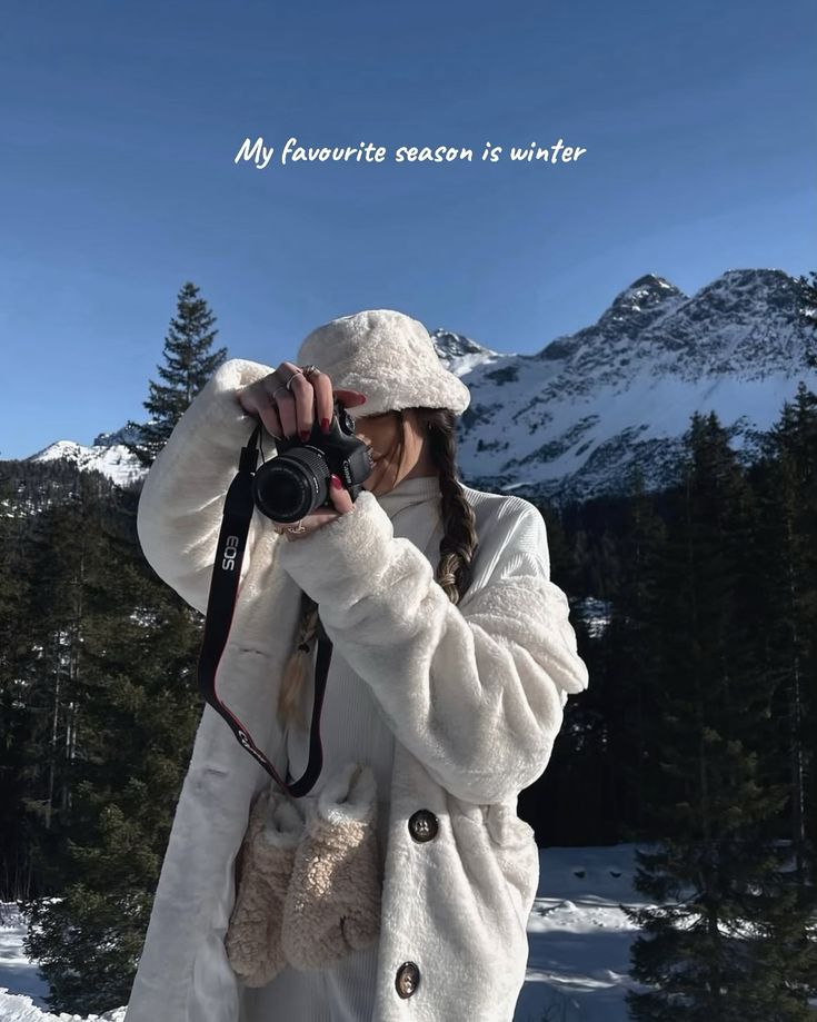 About Me ☁️📸✨__factsaboutme aboutme randomfacts fyp viral photographer zürichswitzerland femalphotographer photography Winter photography in snowy mountains; person in warm coat and hat with camera capturing scenic views under blue sky. | Sky Rye Design Winter photography in snowy mountains; person in warm coat and hat with camera capturing scenic views under blue sky.