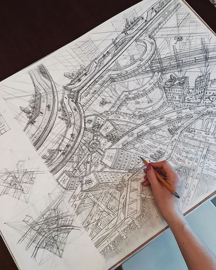 Architecture Student Sketches Birds Eye View of Exquisite Imaginary Cities Hand drawing complex cityscape with intricate architecture and perspective on a sketchpad. Urban design in pencil. | Sky Rye Design Hand drawing complex cityscape with intricate architecture and perspective on a sketchpad. Urban design in pencil.