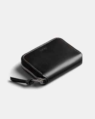 Black leather wallet with zipper, sleek and compact design, ideal for everyday carry.