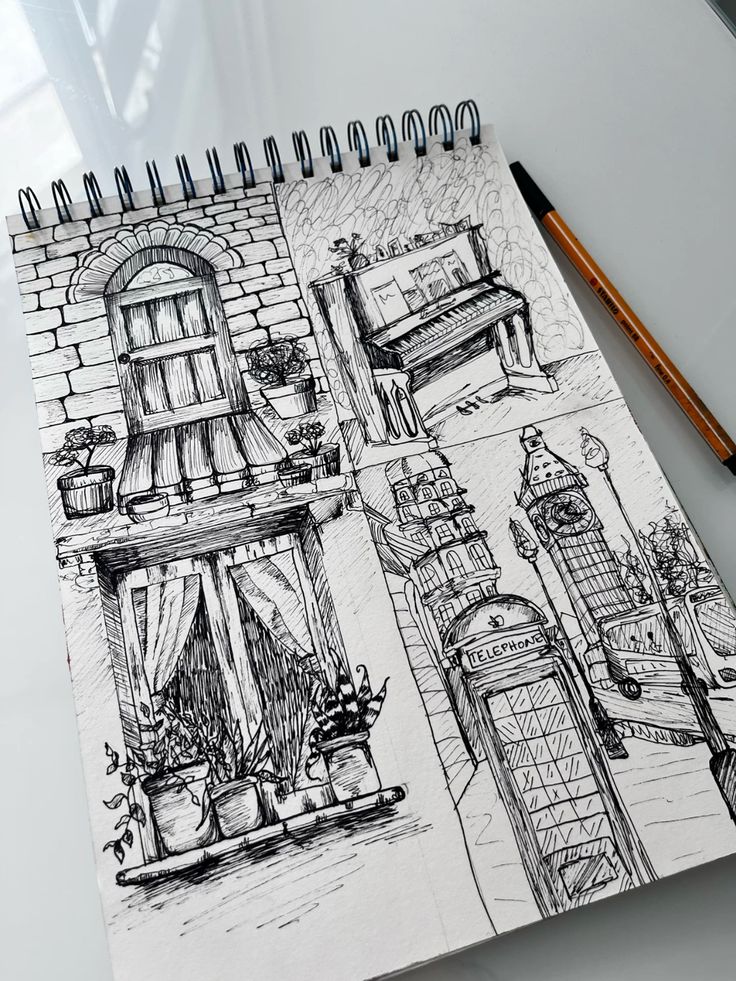 Black pen sketches Sketchbook displaying intricate black ink drawings of urban scenes, including a window, piano, Big Ben, and a vintage telephone booth. | Sky Rye Design Sketchbook displaying intricate black ink drawings of urban scenes, including a window, piano, Big Ben, and a vintage telephone booth.