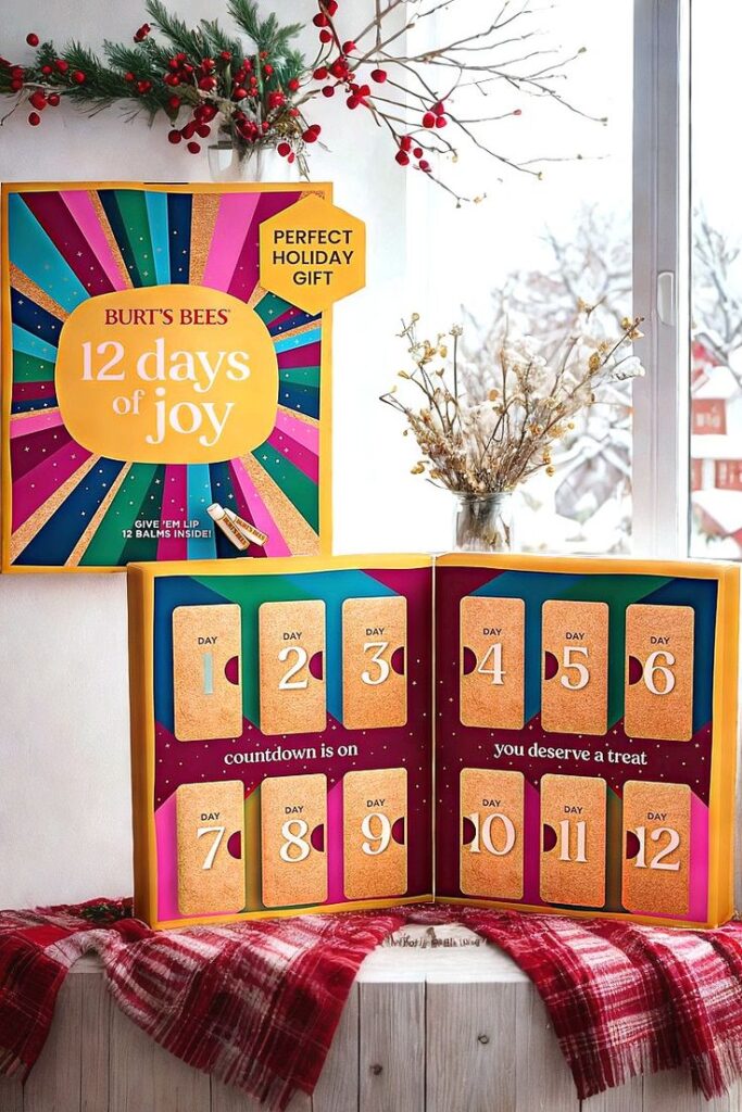 Burt's Bees 12 Days of Joy gift set with festive design, perfect for holiday countdown. Displayed by a snowy window and holiday decor.
