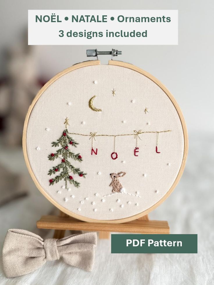 Christmas Embroidery Pattern Whimsical Noel Bunny and Christmas Tree Embroidery PDF Winter Scene Embroidery Design Step by Step Instructions Embroidered Christmas hoop art featuring Noël design with a tree, moon, and rabbit. Three PDF ornament designs included, elegantly displayed. | Sky Rye Design Embroidered Christmas hoop art featuring Noël design with a tree, moon, and rabbit. Three PDF ornament designs included, elegantly displayed.