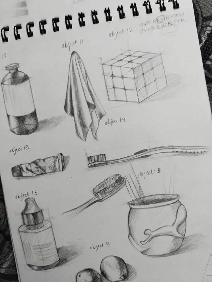 Sketchbook page with detailed pencil drawings of various objects, including a bottle, cloth, cube, toothbrush, and apples.