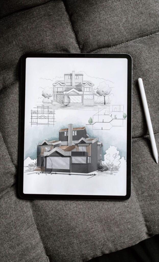Digital Illustration Procreate - Architectural Concept Design Tablet displaying architectural sketches of a modern house on a gray surface with a stylus beside. | Sky Rye Design Tablet displaying architectural sketches of a modern house on a gray surface with a stylus beside.