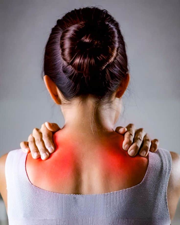 Facebook Woman holds her neck and shoulders in pain, highlighting red sore areas. | Sky Rye Design Woman holds her neck and shoulders in pain, highlighting red sore areas.