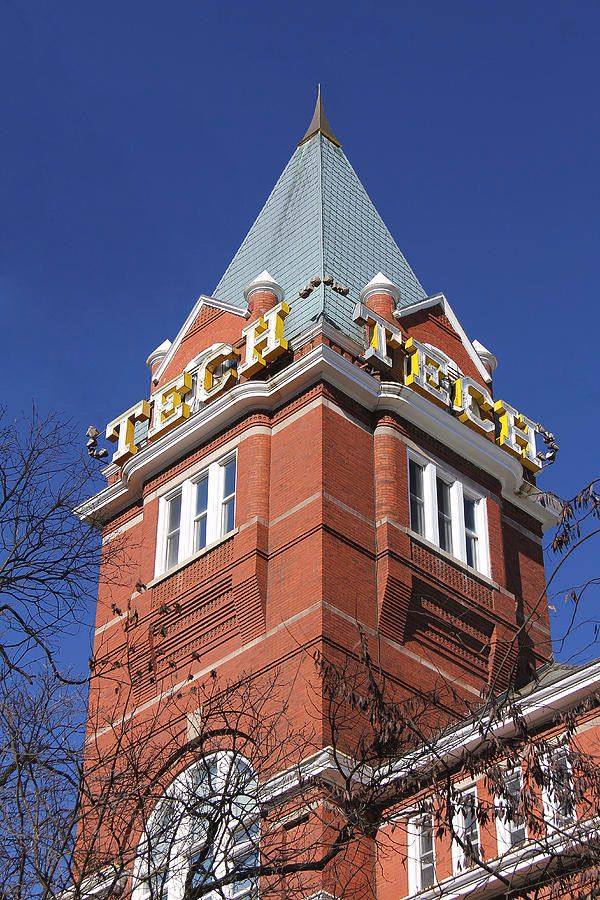 Georgia Tech Historic brick tower under clear blue sky with TECH signage, surrounded by winter trees, showcasing classic architectural details. | Sky Rye Design Historic brick tower under clear blue sky with TECH signage, surrounded by winter trees, showcasing classic architectural details.