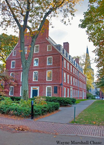 Harvard University founded in 1636 claims itself Historic brick building amidst autumn trees on a college campus, with a tall spire in the background. Courtyard path leads past foliage. | Sky Rye Design Historic brick building amidst autumn trees on a college campus, with a tall spire in the background. Courtyard path leads past foliage.