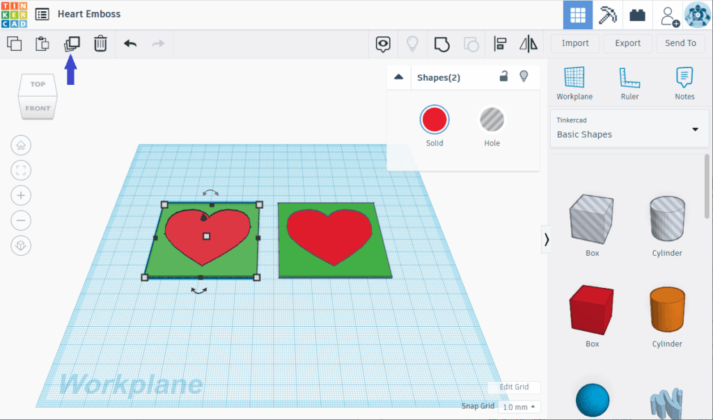 Heart-Emboss-2 3D modeling workspace in Tinkercad showing heart shapes on a green base, with design tools and shapes menu on the side. | Sky Rye Design 3D modeling workspace in Tinkercad showing heart shapes on a green base, with design tools and shapes menu on the side.