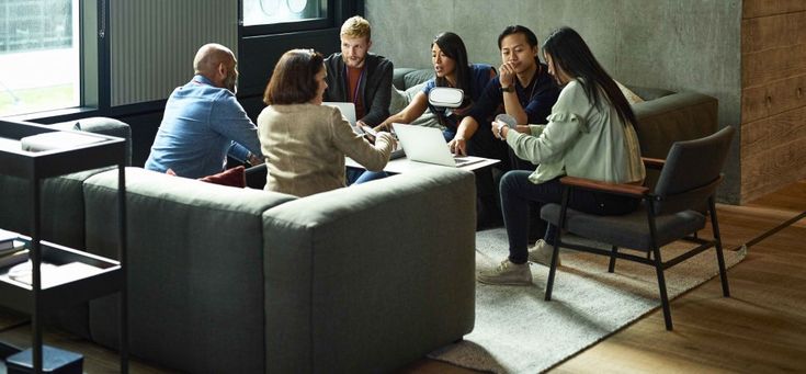 Hiring a Chief of Diversity and Inclusion Wont Fix Your Company Culture Group of diverse colleagues engaged in a collaborative meeting on sofas, focused on laptops and discussions in a modern office setting. | Sky Rye Design Group of diverse colleagues engaged in a collaborative meeting on sofas, focused on laptops and discussions in a modern office setting.