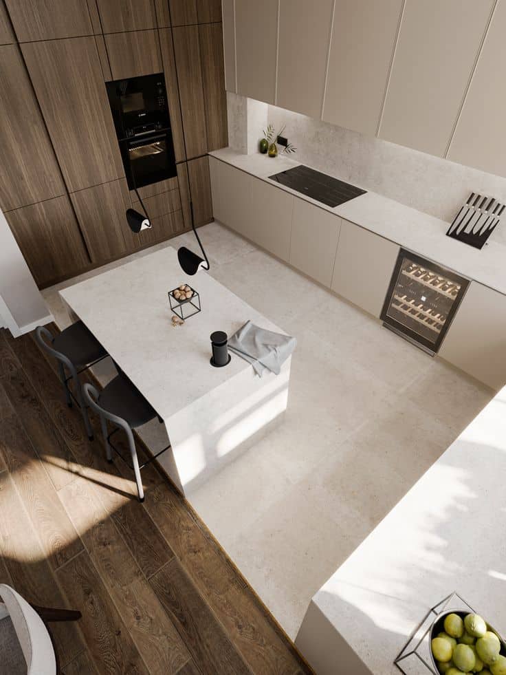 Modern kitchen with sleek white countertops, wooden cabinets, and stylish appliances, featuring a central island with bar stools.