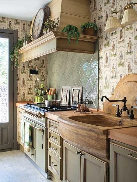 LOVE this kitchen Rustic kitchen with wooden countertops, vintage stove, farmhouse sink, patterned wallpaper, and green accents. Cozy and charming design. | Sky Rye Design Rustic kitchen with wooden countertops, vintage stove, farmhouse sink, patterned wallpaper, and green accents. Cozy and charming design.