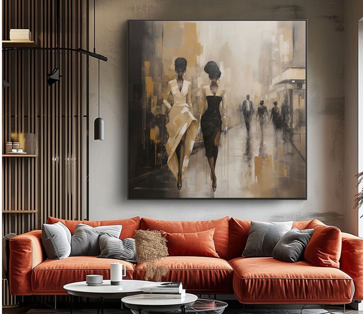 Modern living room with a stylish orange sofa and elegant artwork featuring abstract figures on the wall, enhancing the chic decor.