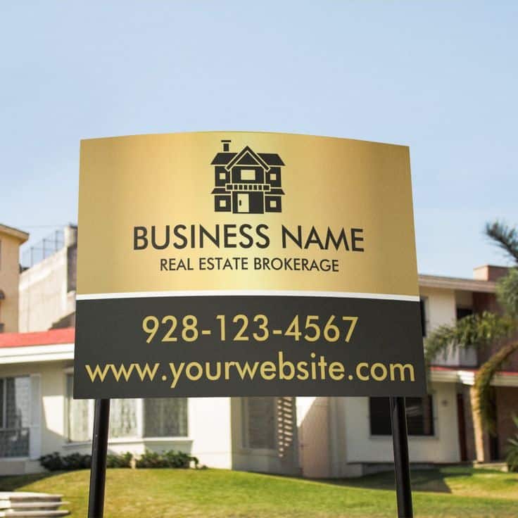 Real estate brokerage sign in front of house with contact info and website details. Ideal for property services and inquiries.