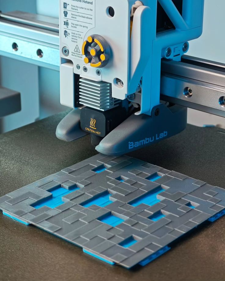 One Part of Minecraft Diamond Block_ Multicolor Printed with AMS Im Working on a diamond block table lamp from minecraft 3D printer from Bambu Lab creating intricate geometric design with blue and grey filament on the build plate. | Sky Rye Design 3D printer from Bambu Lab creating intricate geometric design with blue and grey filament on the build plate.