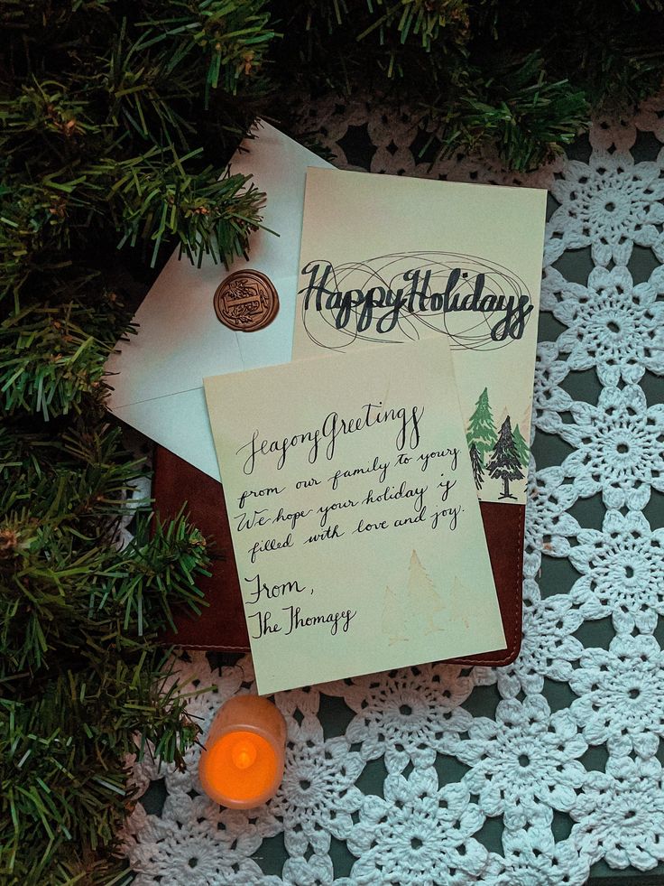 Personalized and Handwritten Batch Christmas and Holiday Cards Festive holiday cards with heartfelt greetings and a glowing candle on a crocheted tablecloth, surrounded by pine branches. | Sky Rye Design Festive holiday cards with heartfelt greetings and a glowing candle on a crocheted tablecloth, surrounded by pine branches. DIY Christmas Cards