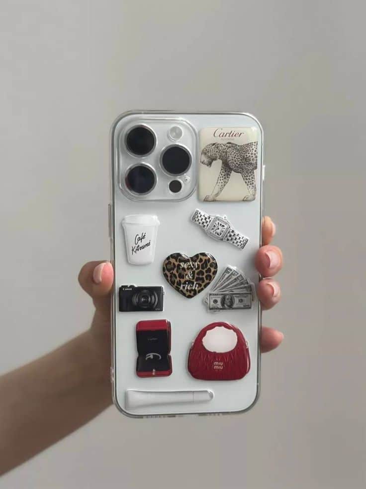 Pinterest Room находки для дома с WB и OZON Stylish iPhone case with decorative stickers including a leopard, camera, cash, heart, and fashion accessories, held in a hand. | Sky Rye Design Stylish iPhone case with decorative stickers including a leopard, camera, cash, heart, and fashion accessories, held in a hand.