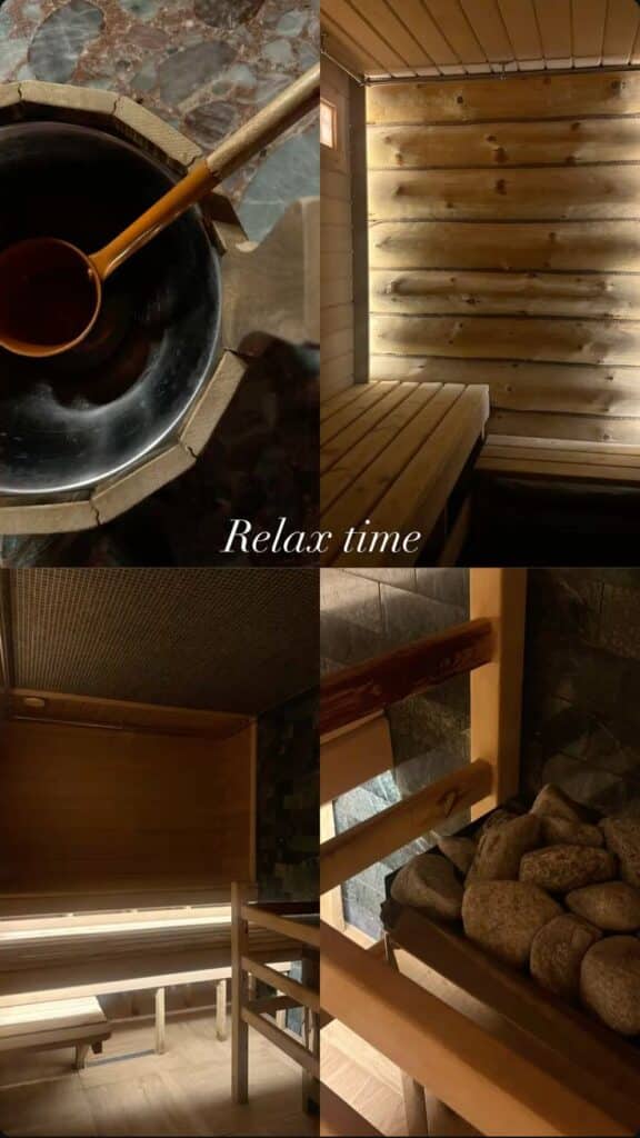 Cozy wooden sauna interior with benches, a bucket, and hot stones. Perfect for relaxation and unwinding.