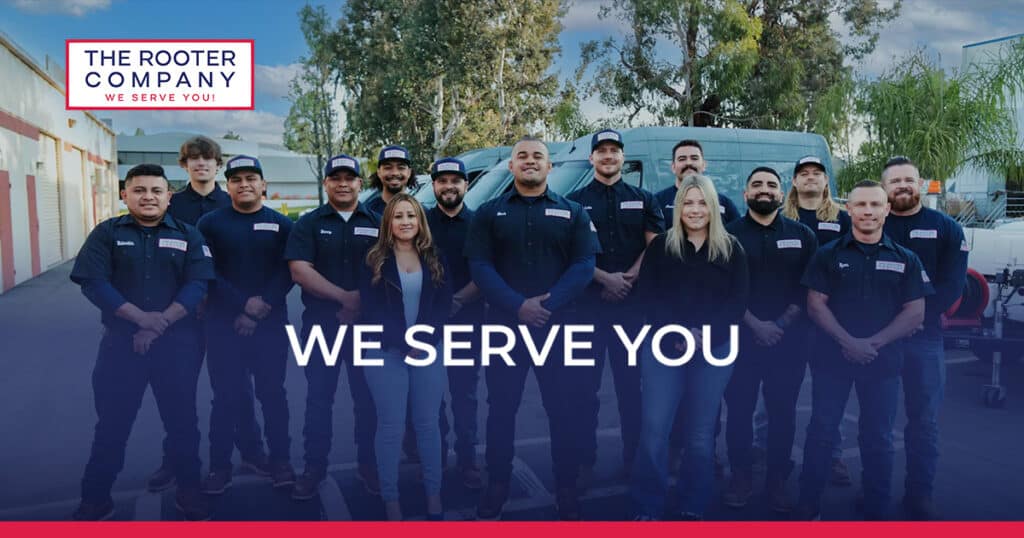 Social-Share Team of professionals from The Rooter Company standing together with a company slogan We Serve You prominently displayed. | Sky Rye Design Team of professionals from The Rooter Company standing together with a company slogan We Serve You prominently displayed.