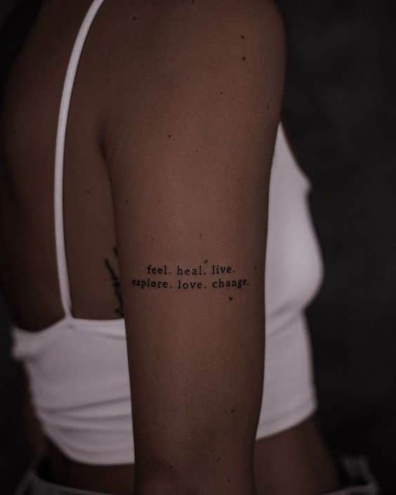 Tattoo font ideas Arm tattoo with motivational words: feel. heal. live. explore. love. change. on a person wearing a white top. | Sky Rye Design Arm tattoo with motivational words: feel. heal. live. explore. love. change. on a person wearing a white top.