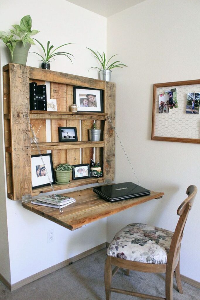 The Ultimate Guide to Choosing the Perfect Pallet for Your DIY Projects - Painted Furniture Ideas Rustic wall-mounted desk with wooden shelves, decorated with plants and photos, creating an inspiring small home office space. | Sky Rye Design Rustic wall-mounted desk with wooden shelves, decorated with plants and photos, creating an inspiring small home office space.