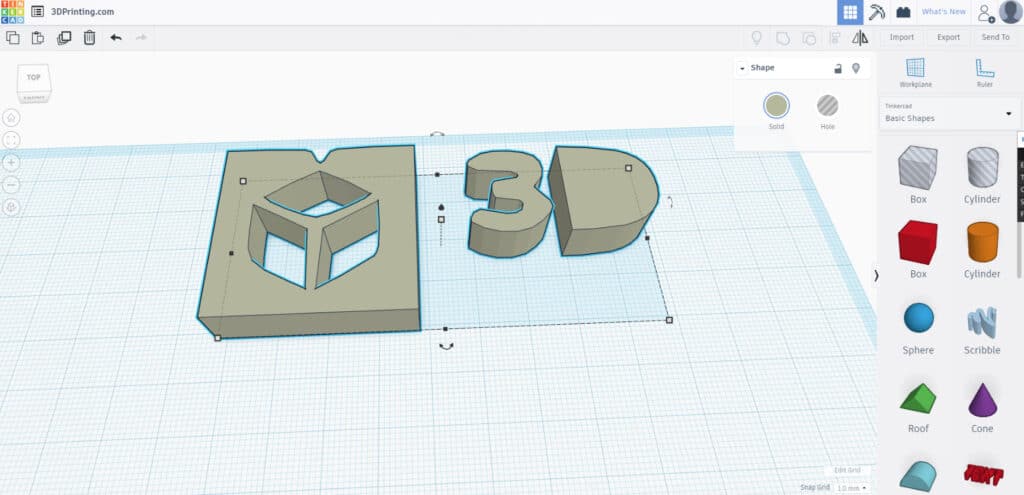 3D design of a geometric cube and 3D text in Tinkercad interface, showcasing modeling tools and shape options for 3D printing.