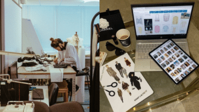 Fashion designer working in studio with sketches on table; laptop and tablet displaying fashion designs nearby.