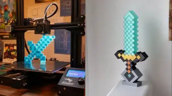 Viewing-Deck-Blog-2025-12-28T200803223 3D printer creating a pixelated sword, inspired by video games, with a completed sword displayed next to it on a stand. | Sky Rye Design 3D printer creating a pixelated sword, inspired by video games, with a completed sword displayed next to it on a stand.