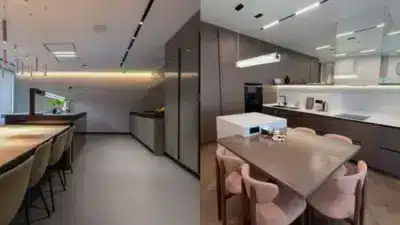 Modern kitchen interiors with sleek cabinets, elegant lighting, and spacious dining areas showcasing contemporary design elements.