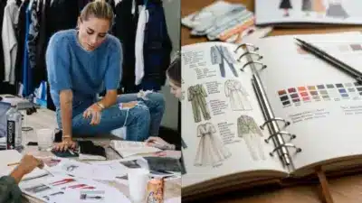 Fashion designer reviewing sketches and fabric samples, sitting on table surrounded by creative team and notebook with clothing illustrations.