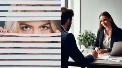 Woman peeking through blinds; professional meeting with businesswoman and man at office desk, discussing documents.