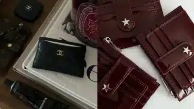 Luxury fashion accessories: black quilted cardholder with gold emblem, and burgundy wallets with star details on a chic display.