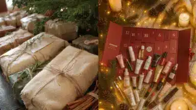 Christmas gifts wrapped under a tree with a holiday beauty advent calendar, candles, and pinecones for a festive atmosphere.