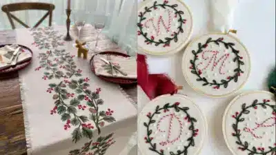 Festive dining table setup with holly print runner and embroidery hoop ornaments featuring initials for Christmas decor inspiration.