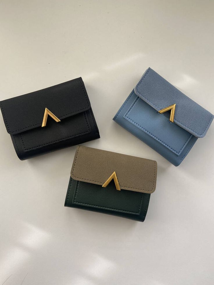 Three stylish wallets in black, blue, and brown with gold accents, displayed on a light background, perfect for fashion accessories.