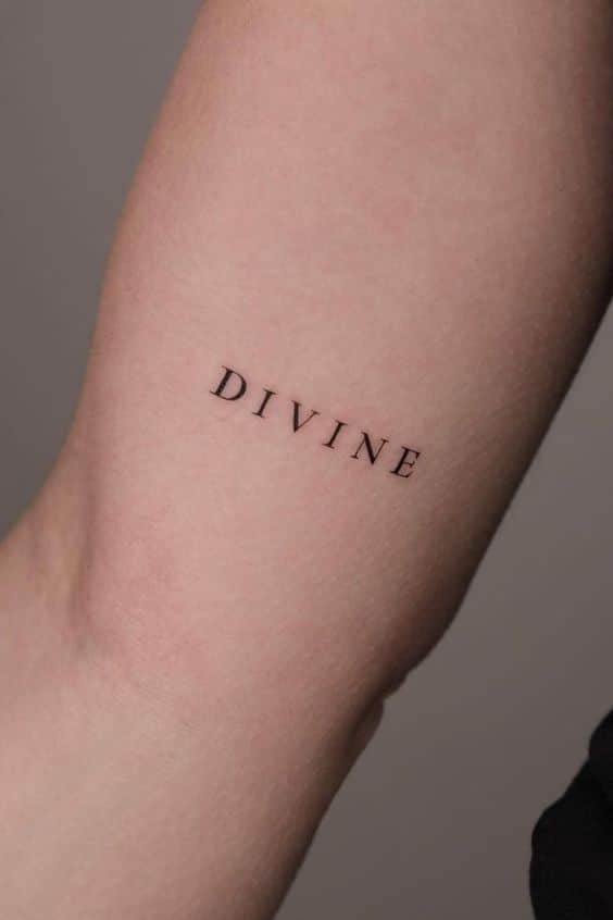 Word tattoo ⚡ Fonts for tattoos fontsfortattoos tattoo tattoo tattoos tattoos Close-up of a minimalist tattoo on an arm showing the word DIVINE in black ink. | Sky Rye Design Close-up of a minimalist tattoo on an arm showing the word DIVINE in black ink.