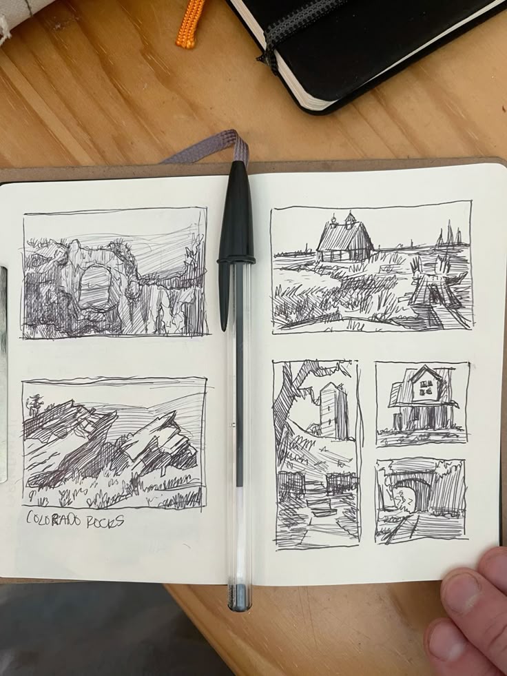 af8977b8cba6935521cbafb813ce403d Open sketchbook with pen, featuring six hand-drawn landscape thumbnails, including a barn and rocky formations labeled Colorado Rocks. | Sky Rye Design Open sketchbook with pen, featuring six hand-drawn landscape thumbnails, including a barn and rocky formations labeled Colorado Rocks.