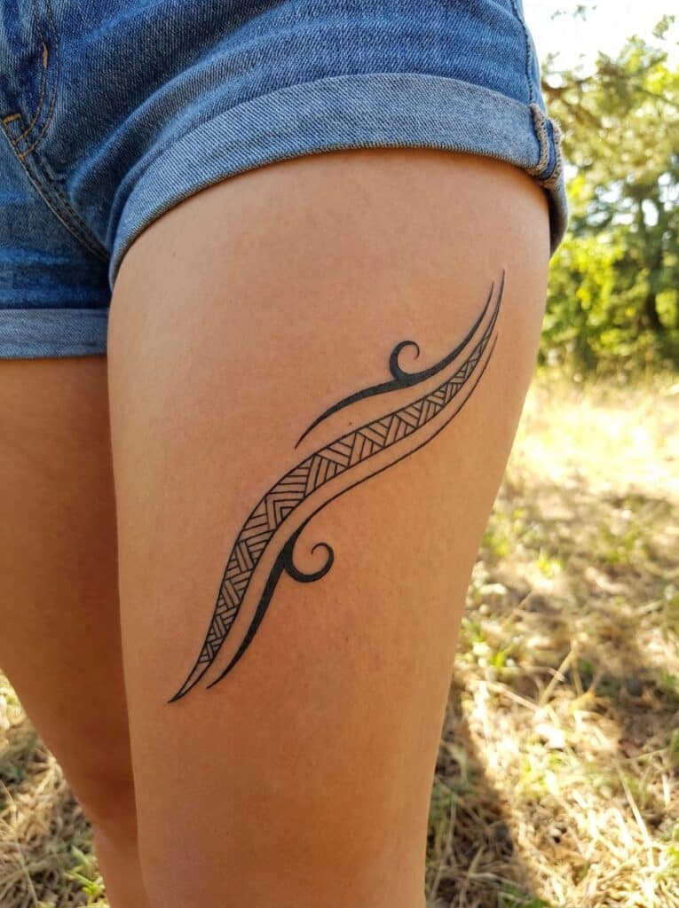 ai-photo-studio-1765816866565-2 Ornate tribal tattoo design on upper thigh, near denim shorts, in a sunny outdoor setting. | Sky Rye Design Ornate tribal tattoo design on upper thigh, near denim shorts, in a sunny outdoor setting. tribal thigh tattoos women