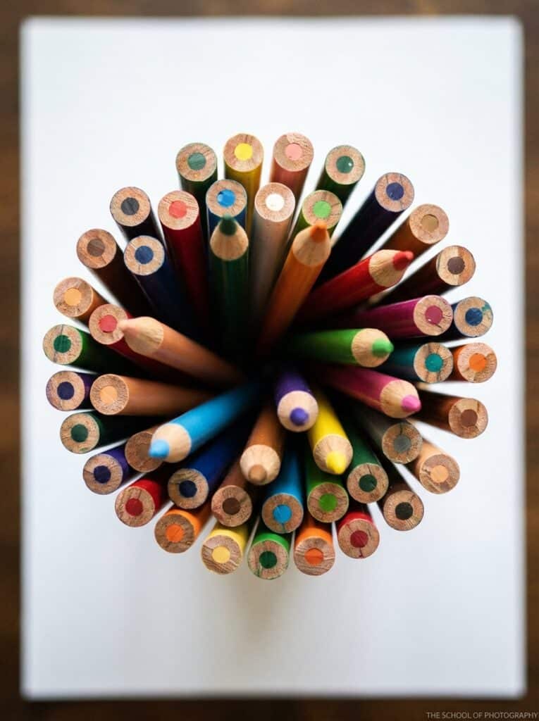 ai-photo-studio-1766413649579-1 Top view of vibrant colored pencils arranged in a circle on a white background, showcasing artistic creativity and vivid hues. | Sky Rye Design Top view of vibrant colored pencils arranged in a circle on a white background, showcasing artistic creativity and vivid hues.