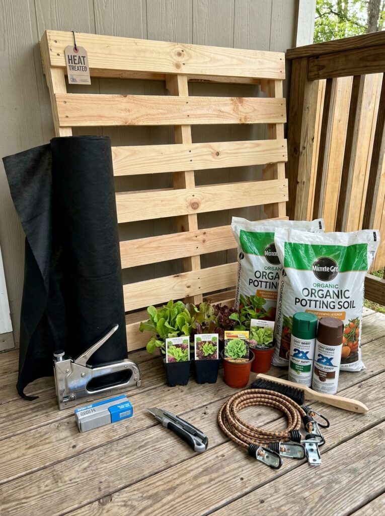 ai-photo-studio-1766676877489-2 DIY garden project setup with wooden pallet, potting soil, small plants, and tools on a wooden deck, ready for vertical gardening. | Sky Rye Design DIY garden project setup with wooden pallet, potting soil, small plants, and tools on a wooden deck, ready for vertical gardening.