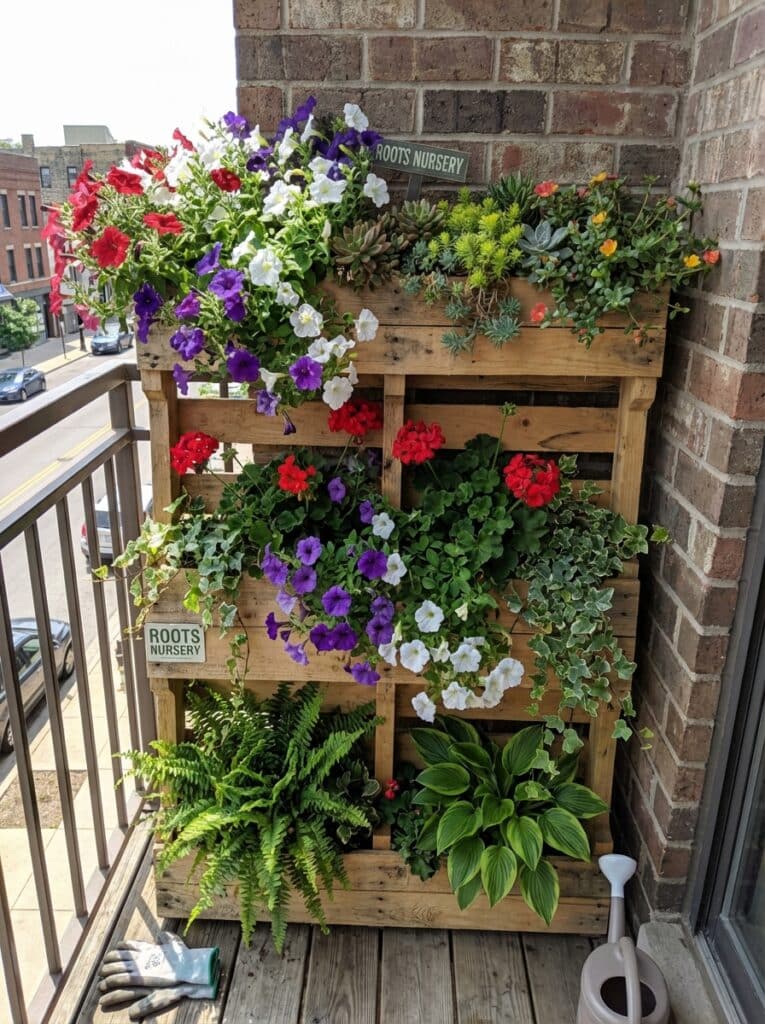 ai-photo-studio-1766678597175-1 Vertical wooden planter with colorful flowers and greenery on a balcony. Urban gardening inspiration with vibrant blooms and foliage. | Sky Rye Design Vertical wooden planter with colorful flowers and greenery on a balcony. Urban gardening inspiration with vibrant blooms and foliage.