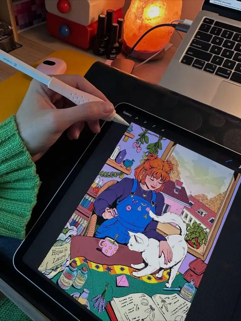 Hand drawing digital art of a woman with a cat on a tablet. Cozy workspace with a lamp and laptop nearby.