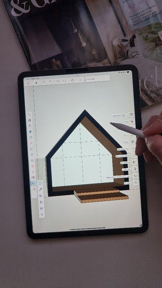 b8222154ba2c16f72c9d95ac140ba901 Digital tablet displaying architectural design, with a hand holding a stylus. Magazines in the background. Modern home design concept. | Sky Rye Design Digital tablet displaying architectural design, with a hand holding a stylus. Magazines in the background. Modern home design concept.